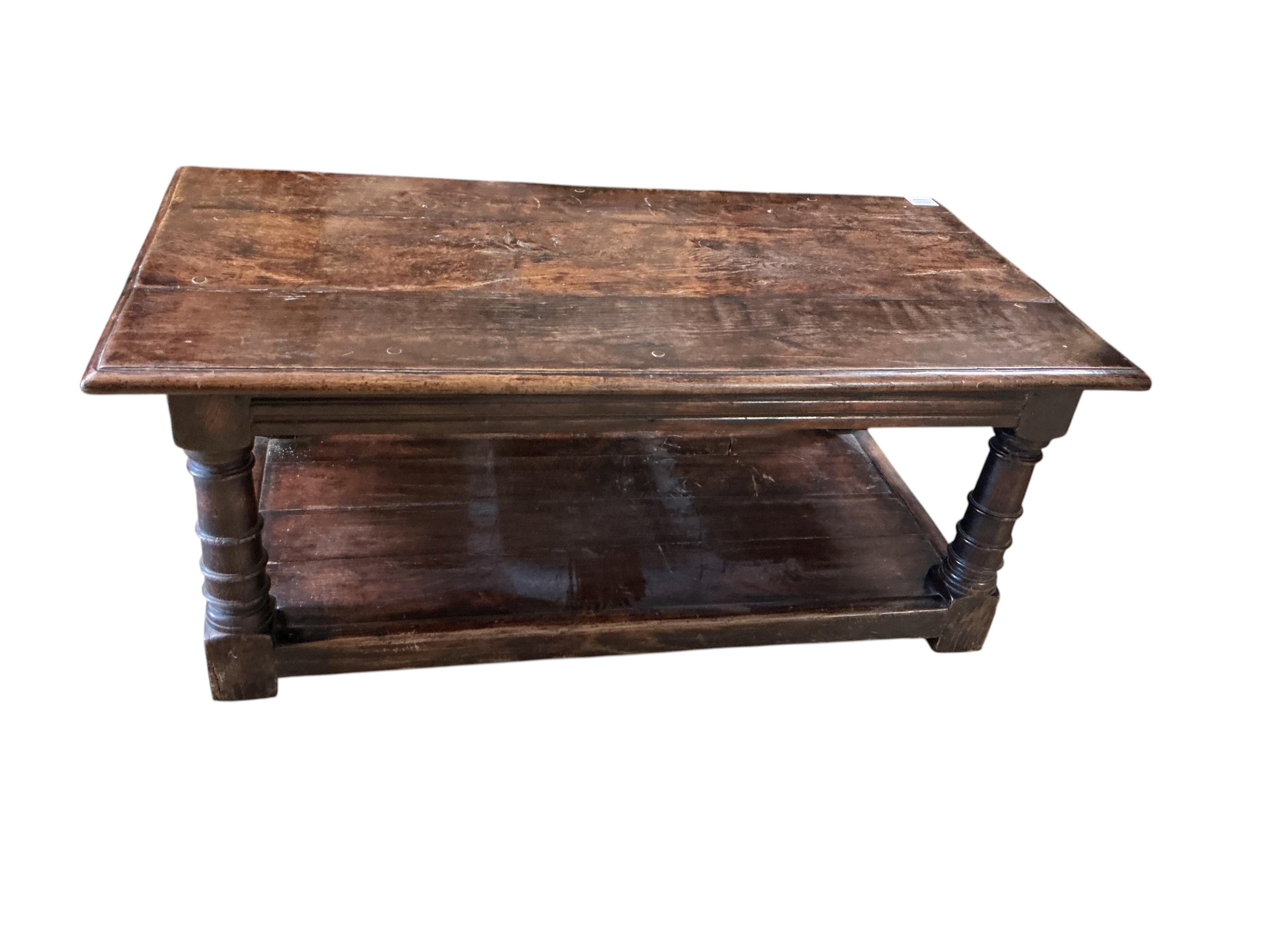 A 17th century style rectangular oak two tier coffee table, width 106c, depth 55cm, height 43cm